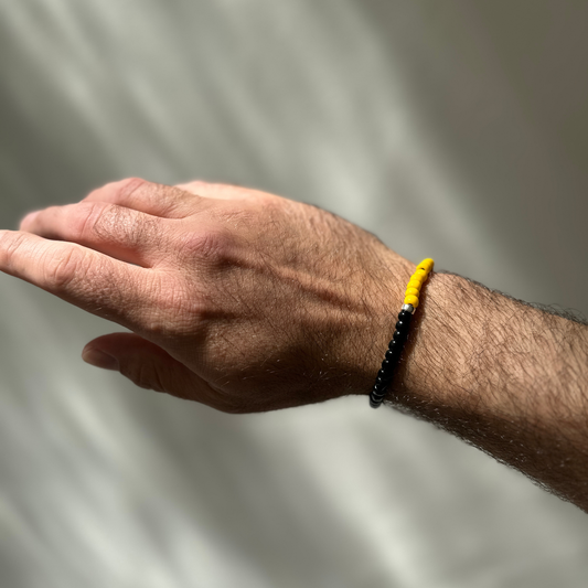 One Silver / Black & Yellow Glass